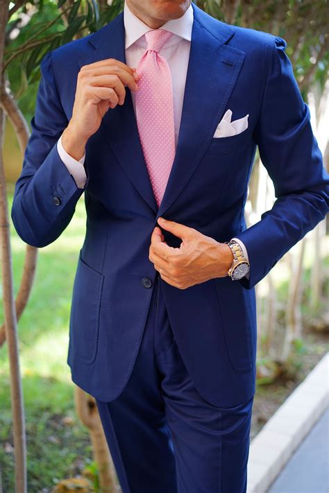 pink tie navy blue suit